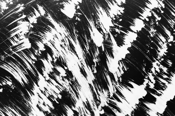 Patrones de pintura blanca de un pincel sobre un fondo negro —  Fotos de Stock