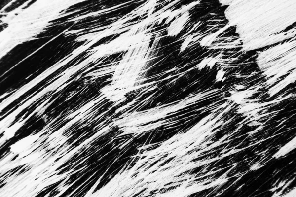 Patterns of white paint from a brush on a black background — Stock Photo, Image