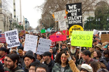 Oakland, CA - Jan 20, 2020: Unidentified participants at the 6th annual rally and march to reclaim the spirit of Martin Luther King Jrs legacy. Starting at Frank Ogawa Plaza and marching down 14th street.