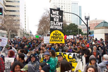 Oakland, CA - Jan 20, 2020: Unidentified participants at the 6th annual rally and march to reclaim the spirit of Martin Luther King Jrs legacy. Starting at Frank Ogawa Plaza and marching down 14th street.