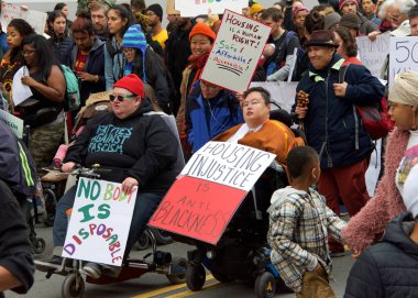 Oakland, CA - Jan 20, 2020: Unidentified participants at the 6th annual rally and march to reclaim the spirit of Martin Luther King Jrs legacy. Starting at Frank Ogawa Plaza and marching down 14th street.