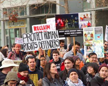 Oakland, CA - Jan 20, 2020: Unidentified participants at the 6th annual rally and march to reclaim the spirit of Martin Luther King Jrs legacy. Starting at Frank Ogawa Plaza and marching down 14th street.