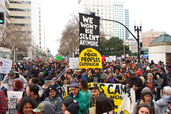 Oakland, CA - Jan 20, 2020: Unidentified participants at the 6th annual rally and march to reclaim the spirit of Martin Luther King Jrs legacy. Starting at Frank Ogawa Plaza and marching down 14th street.