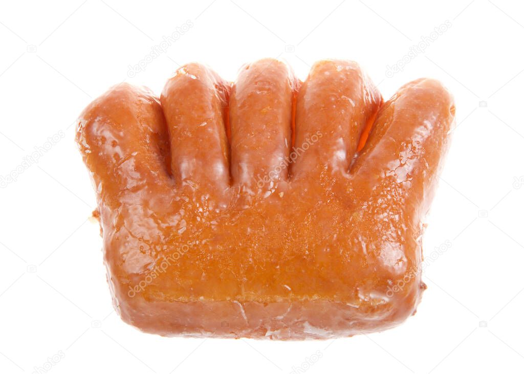 Top view flat lay of one bear claw donut isolated on white. A yeast donut shaped like a bear claw. filled with apple fruit and covered in sugar glaze.