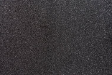 Güneşin yansımaları ile gri arkaplan. Çünkü boyanın taşıdığı demir dolgular...