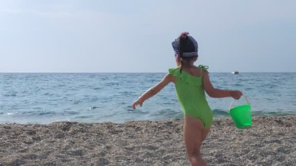 Adorable little girl playing on beach in summer — Stock Video