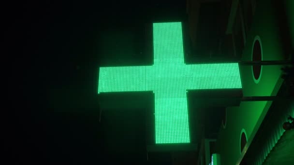 LED cross sign near pharmacy — Stockvideo