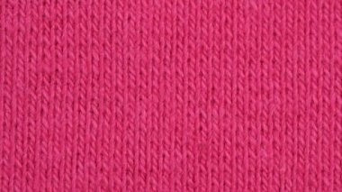 Tekstil arka planı - pembe pamuk elastane esnek kumaş. Makro atış.