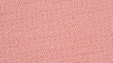 Tekstil arka planı. Pembe naylon elastane kumaş. Makro atış.