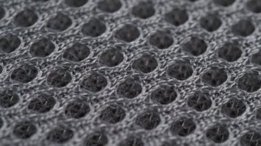 Tekstil arka planı, gri polyester sentetik ağ kumaşı. Makro atış
