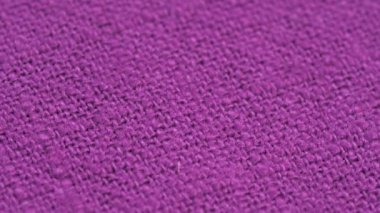 Textile background - 100 percent purple cotton fabric. Macro shoot