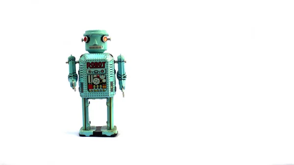 Beyaz arka planda izole edilmiş klasik bir robot oyuncak..