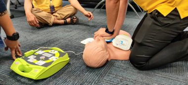Bangkok/Thailand-February 24 2020 : Employees are practicing how to use automatic heart stimulation to rescue people who stop breathing.