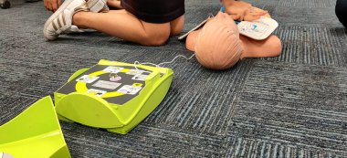 Bangkok/Thailand-February 24 2020 : Employees are practicing how to use automatic heart stimulation to rescue people who stop breathing.