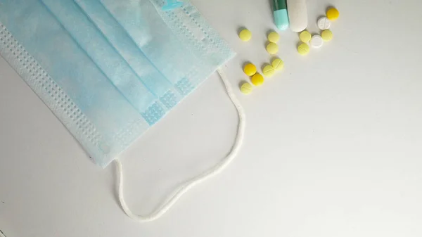 Medical mask And medicines on the white background.