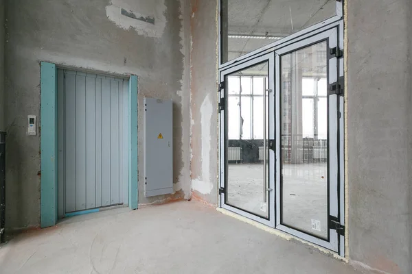 empty pure commercial office building undecorated in gray colors.open space office