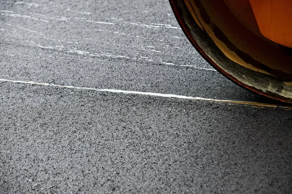 Asphalt paving with a steel wheel roller — Stock Photo, Image