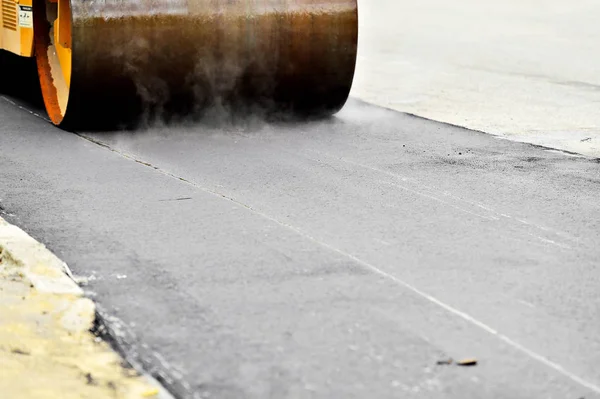 Asphalt paving with a steel wheel roller — Stock Photo, Image