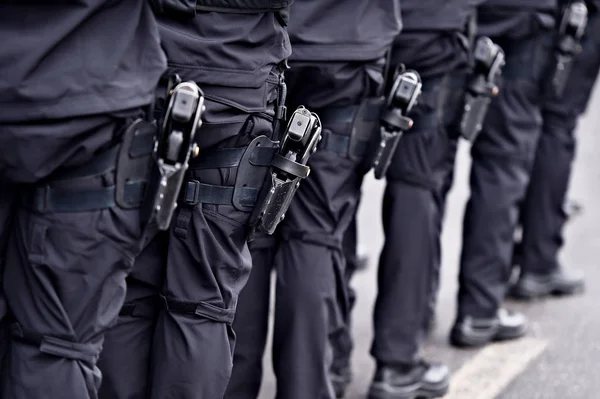 Special forces soldiers with pistols in scabbards — Stock Photo, Image