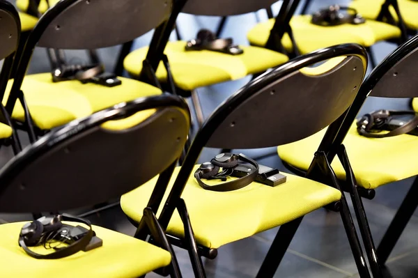 Translation headphones on a chair — Stock Photo, Image