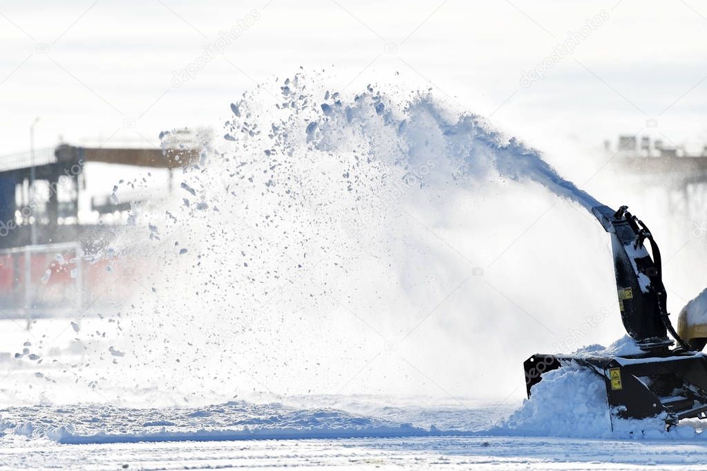 Snow removal machine in action