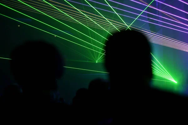 People watching laser show — Stock Photo, Image