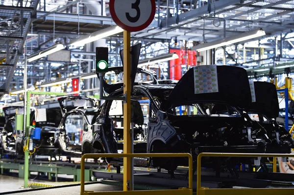 Car bodies on the production line — Stock Photo, Image