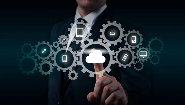 Businessman holding a cloud connected to many objects on virtual screen concept about the internet of things — Stock Photo, Image