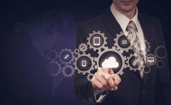 Businessman holding a cloud connected to many objects on virtual screen concept about the internet of things — Stock Photo, Image