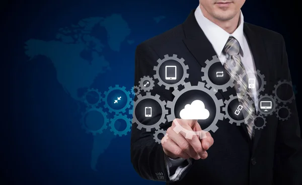 Businessman holding a cloud connected to many objects on virtual screen concept about the internet of things