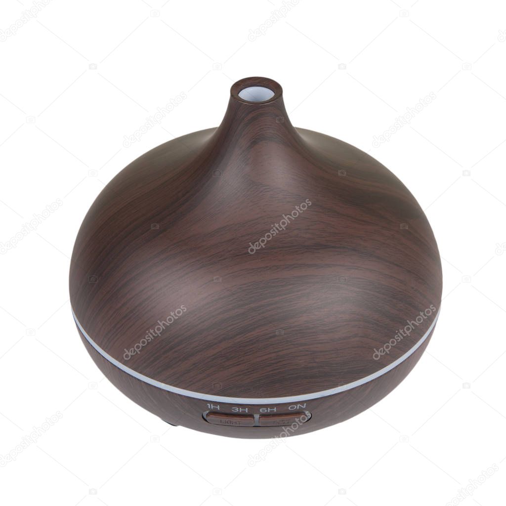 Electric wooden aroma oil diffuser isolated on white background