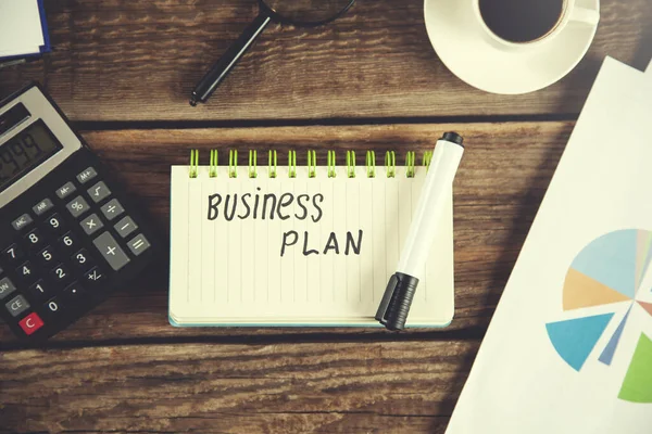 Business plan on notepad — Stock Photo, Image