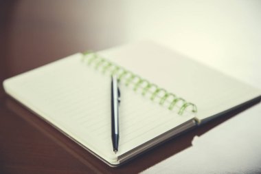 pen on notepad on the desk