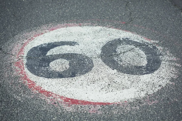 60 text in asphalt  road in the street