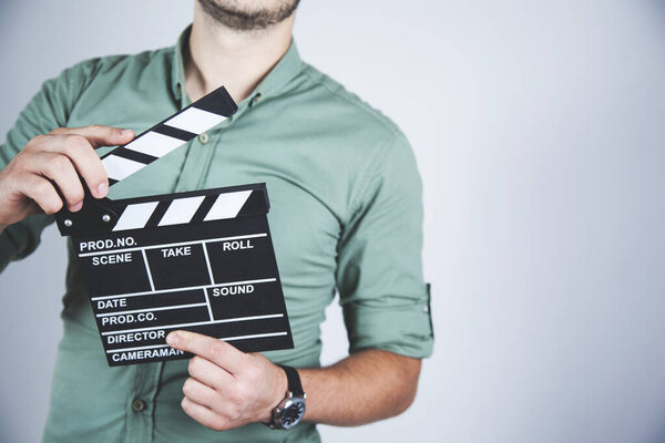 young business man hand movie sign in studio