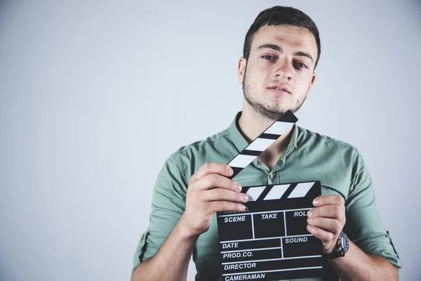 young business man hand movie sign in studio