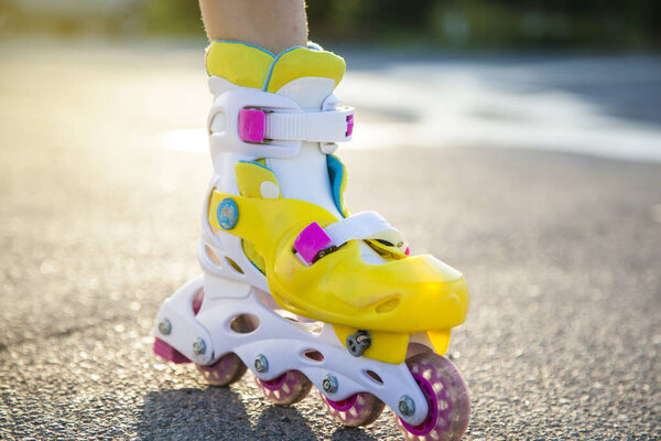 girl baby feet roller in the street