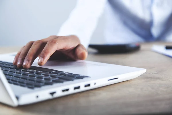 man working in document with computer on desk