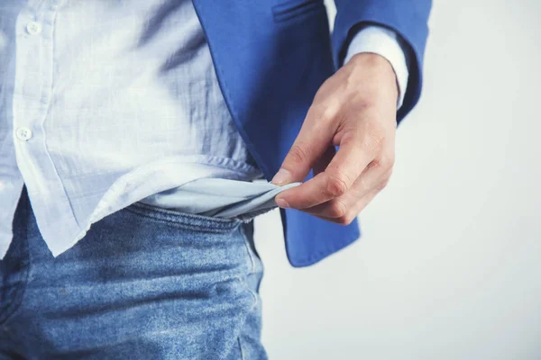 Mann Hand Leere Tasche Auf Grauem Wandhintergrund — Stockfoto