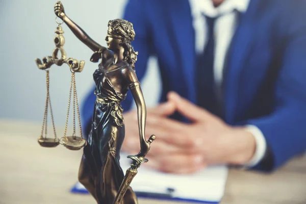 man working with justice lady and judge on desk