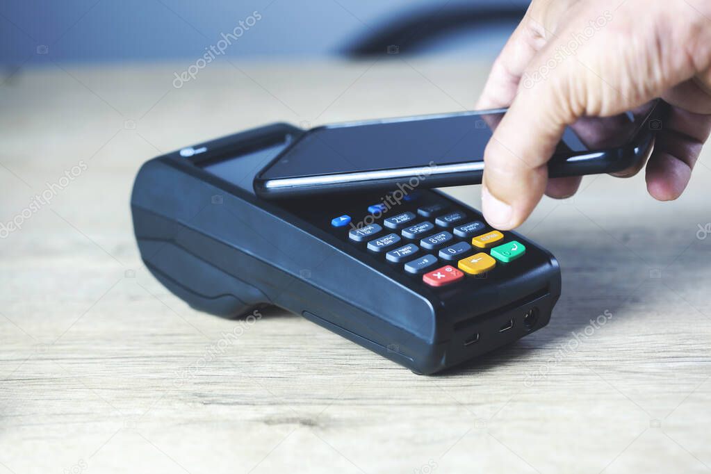 man hand credit machine payment for payment from customer and phone