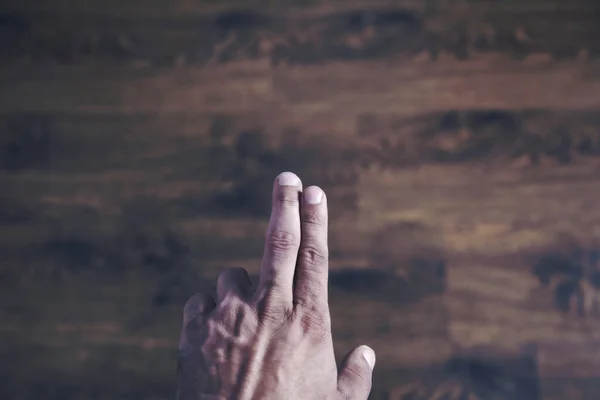 man touching in screen on gray wall background