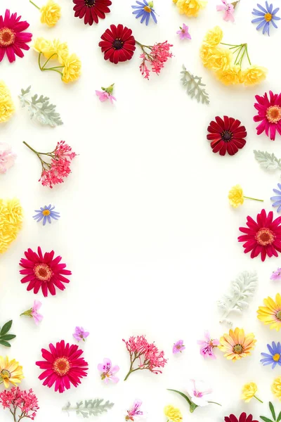 Egg shaped frame made from spring flowers. Easter spring holiday concept.Flat lay, top view, copy space