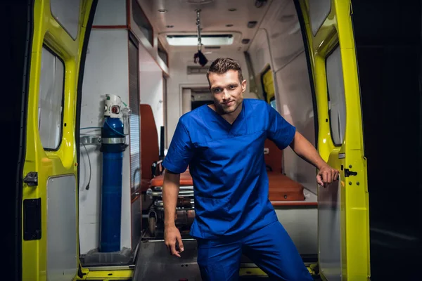 Corpsman stands and looks at camera in the ambulance car — ストック写真