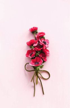 Bouquet anemones  on the table, top view, copy space