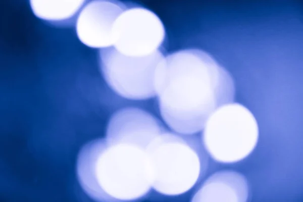 Defocused soft lights Shot Of Colorful classic blue pantone Abstract Background Out of focus light dots, Bokeh