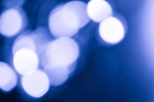 Defocused soft lights Shot Of Colorful classic blue pantone Abstract Background Out of focus light dots, Bokeh