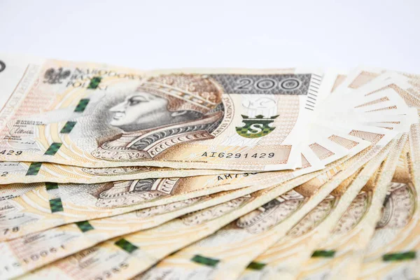Polaco zloty moneda, polonia dinero en el fondo blanco, ciento doscientos polaco efectivo — Foto de Stock