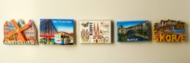 Banner Magnets on refrigerator from travelling - stock photo clipart