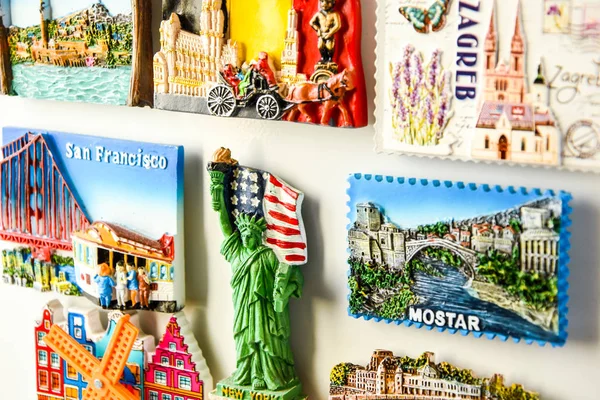 Magnets on refrigerator from travelling - stock photo, souvenir shopping — Stock Photo, Image